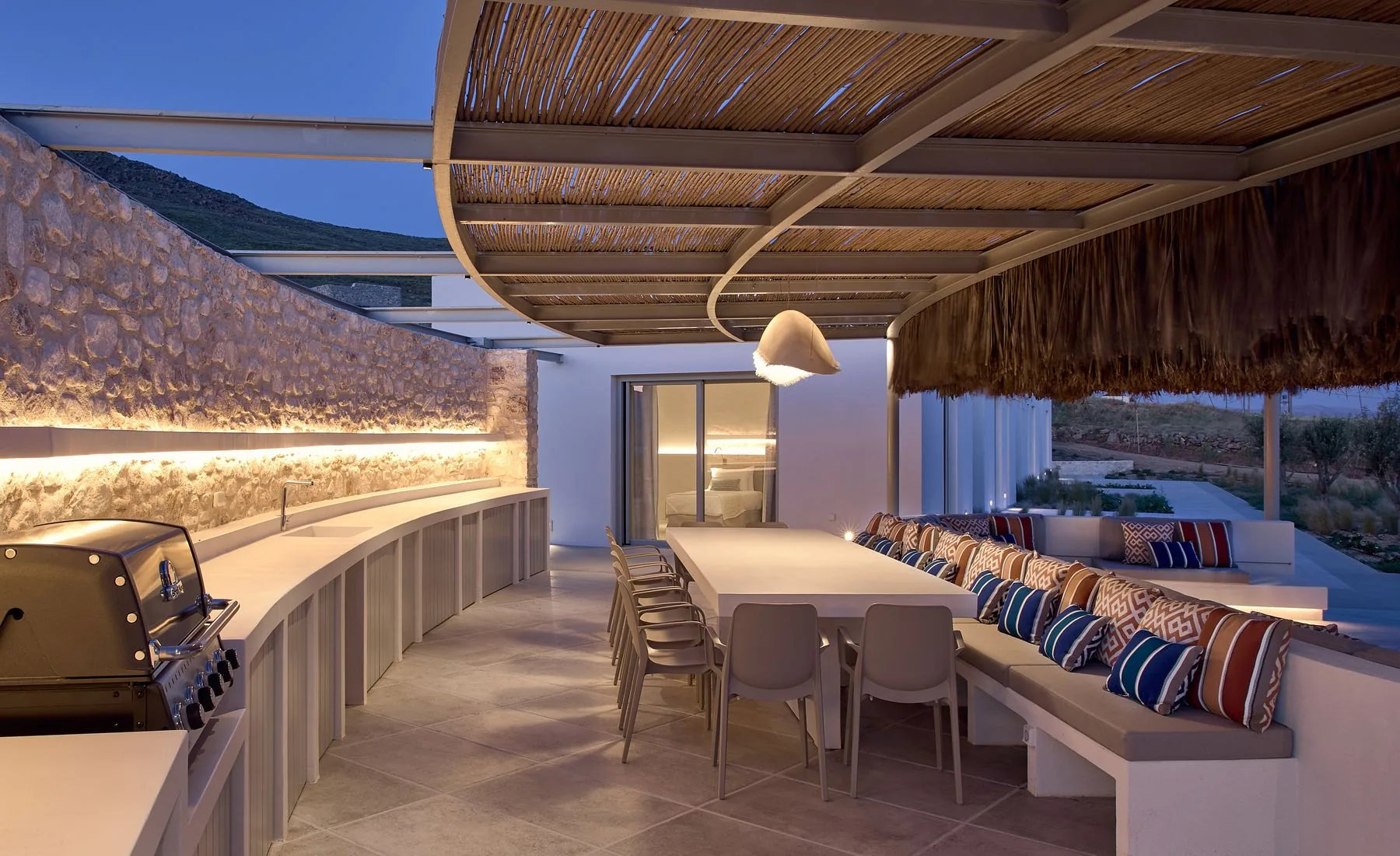 Covered outdoor dining pavilion and lounge — luxury villa Paros
