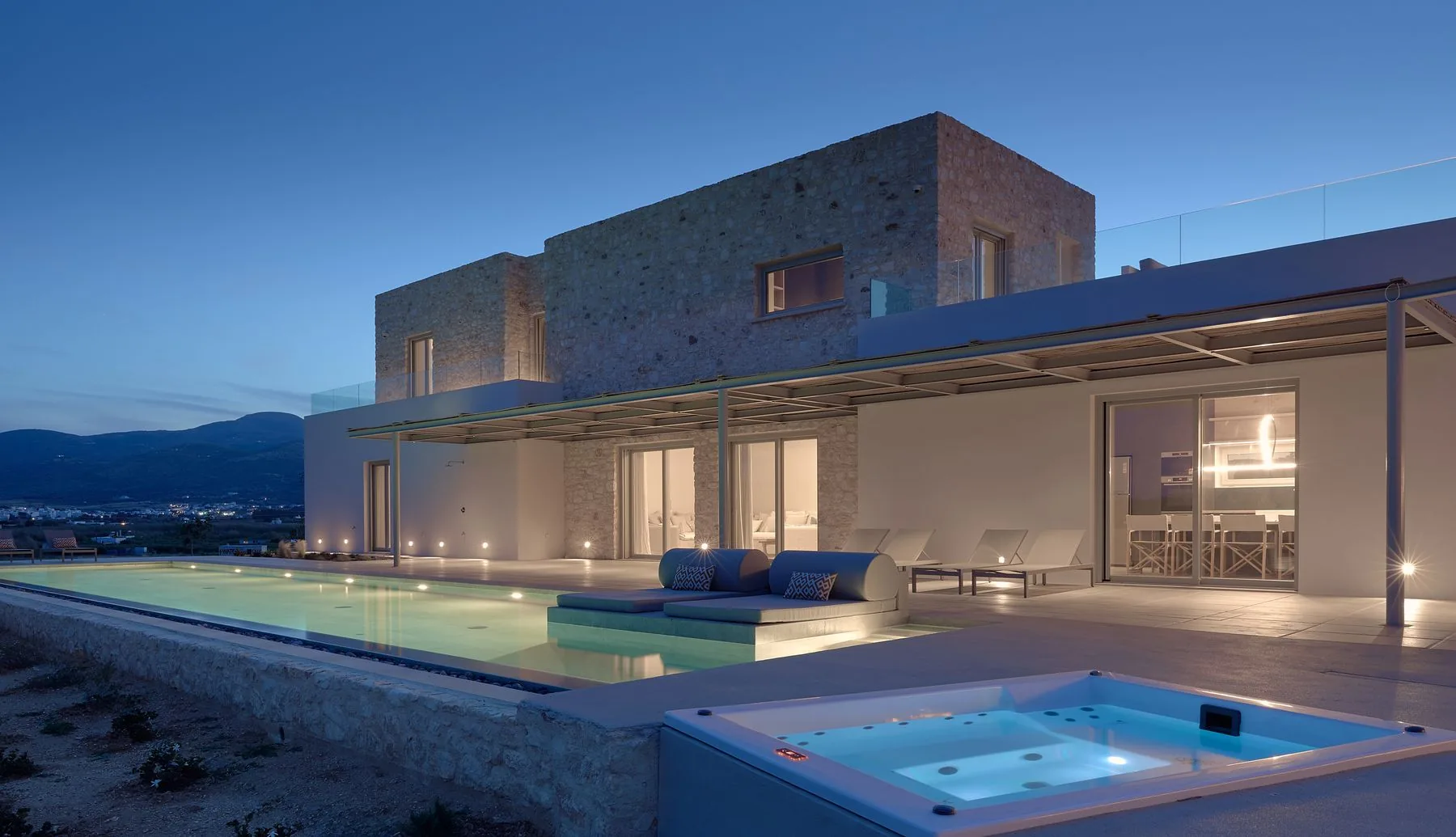 Luxury Paros villa pool at dusk — Villa Ananda